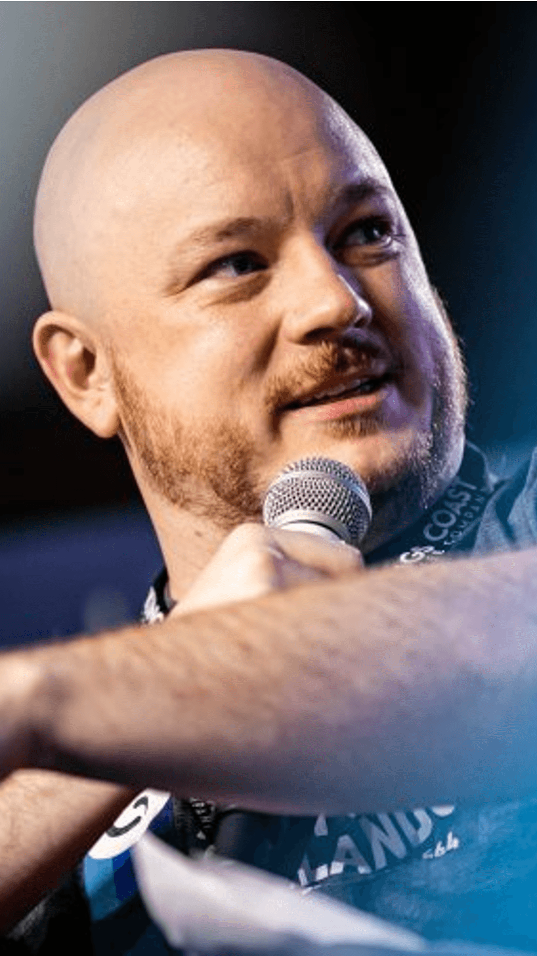 Creator client Broman on stage with a microphone